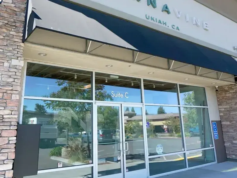 Cannavine storefront with blue awning and glass doors in Ukiah