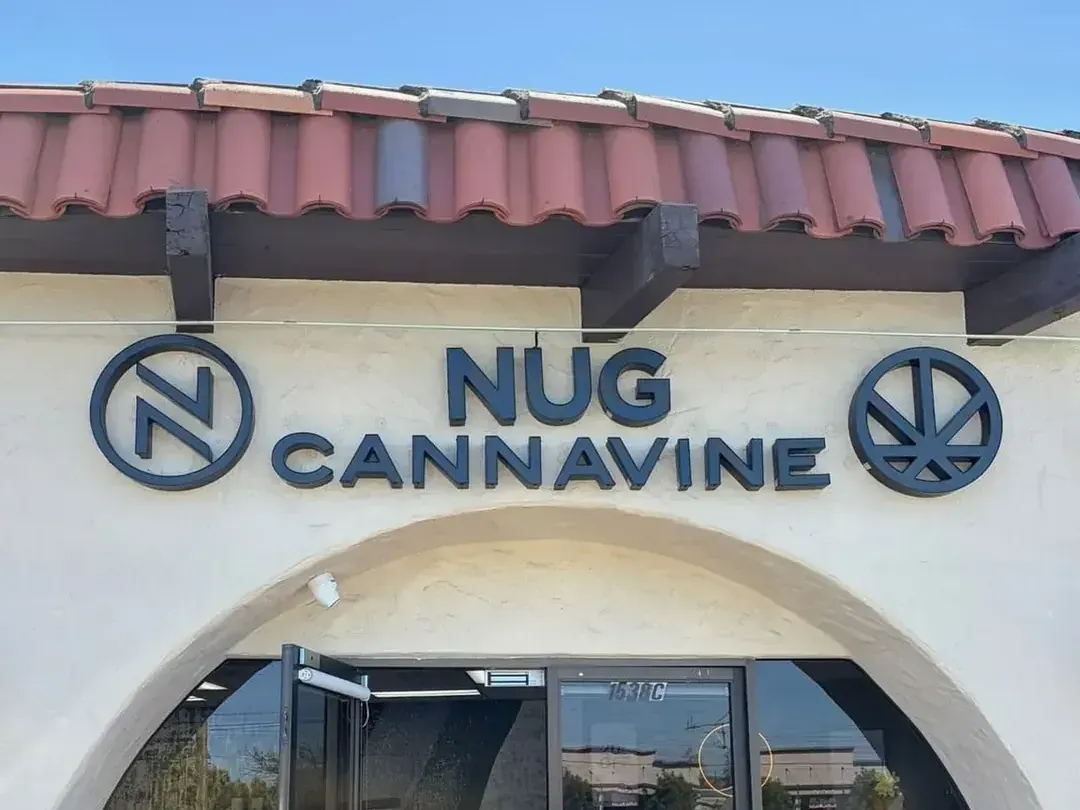 Nug Cannavine dispensary entrance with red tile roof and signage
