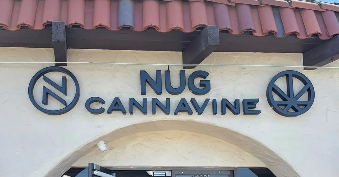 Nug Cannavine storefront sign with logo on Belmont building exterior